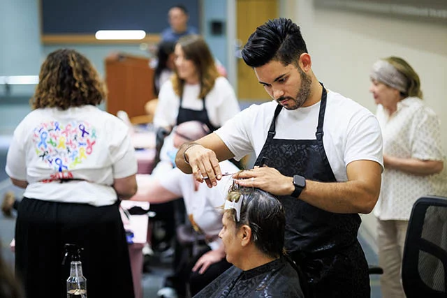 Samuel De La Rosa Mata, a hairstylist and community volunteer, provided free haircuts and hairstyling services to women who are going through cancer treatments. Photo by Michael Ciaglo, for UCHealth.