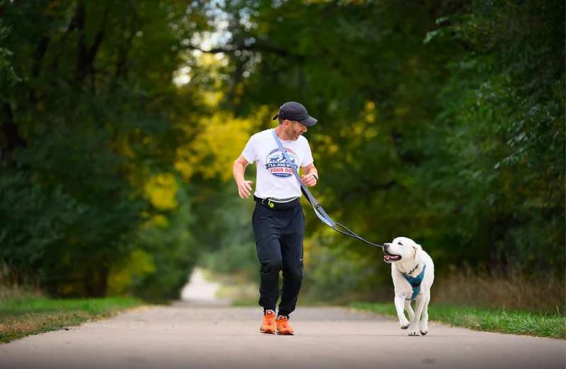 Sean Sindler and his dog. Sindler owns Jog With Your Dog, and assists other struggling veterans by supporting the people and programs that helped him. Photo by Mark Reis, for UCHealth.